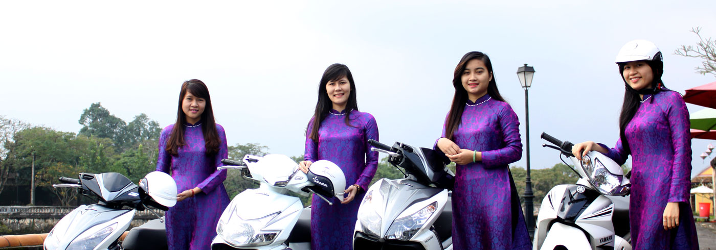 AoDaiGo guides in traditional ao dai with Vespa scooters