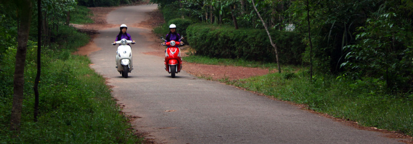 Vespa countryside tour through green roads of Hue
